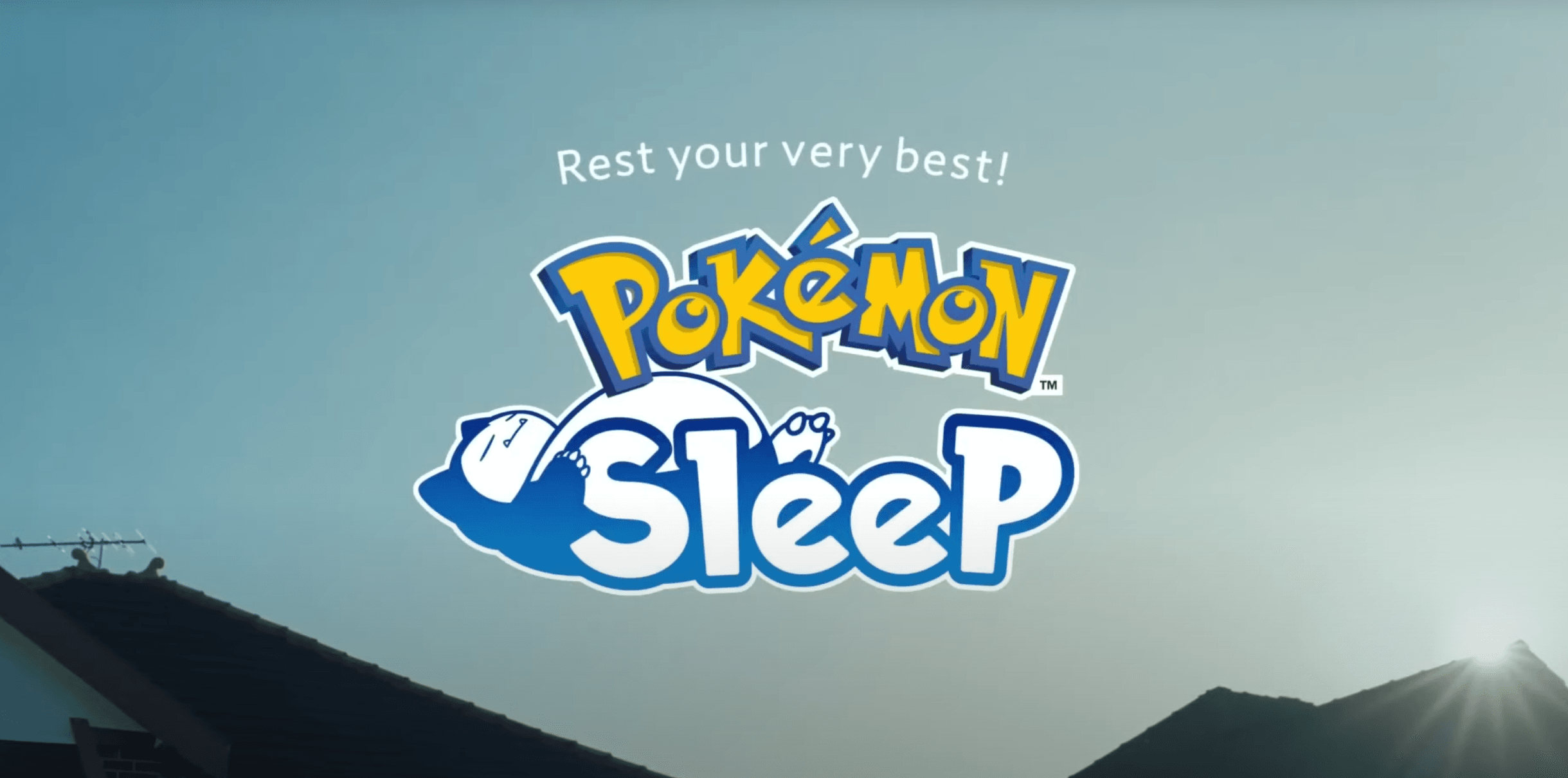 Pokémon Sleep logo in front of a mountain view